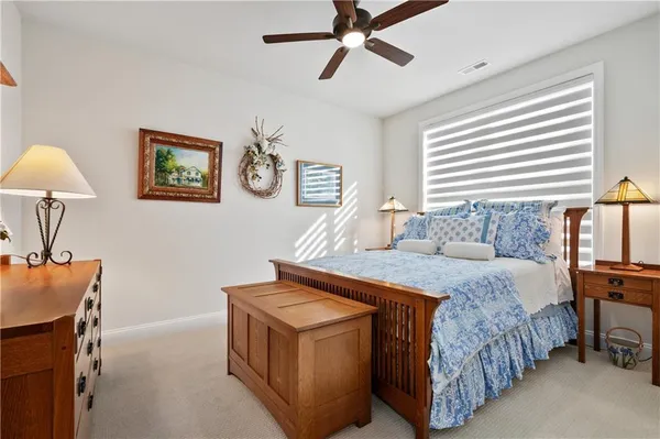 a bed room with a bed and a lamp