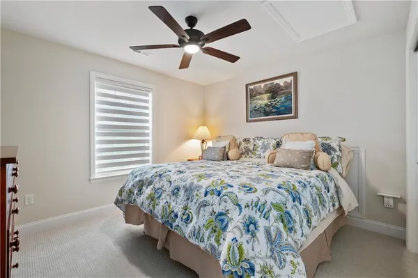 a bedroom with bed and window