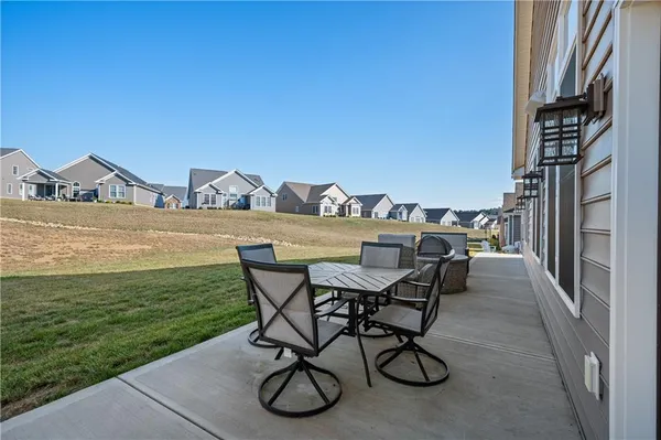 a view of a chairs and table on the terrace