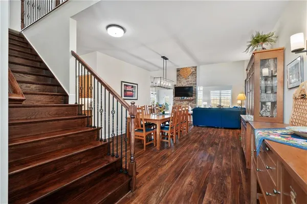 a view of a livingroom with furniture and hardwood floor