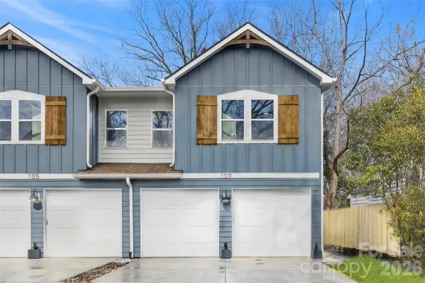 a front view of a house with a garage