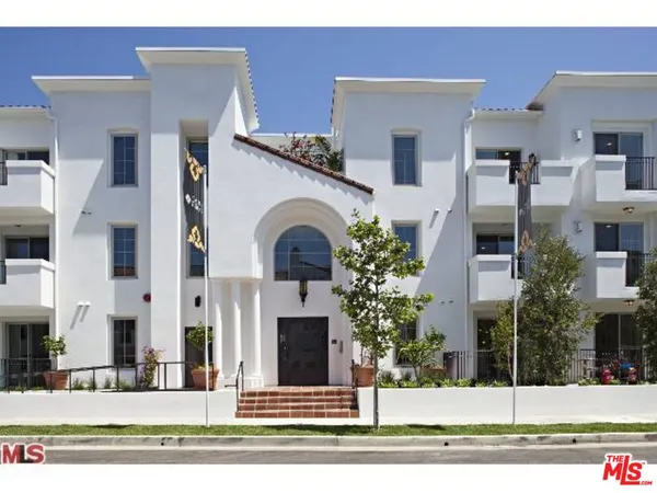 a view of a building with a garden