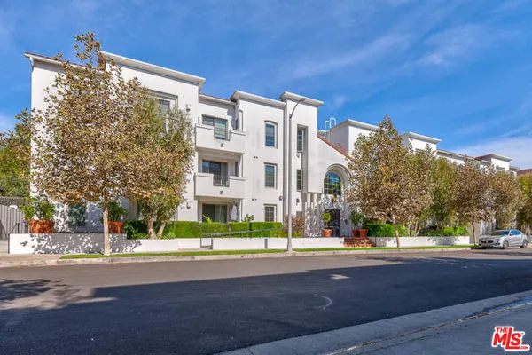 a view of a building with a street