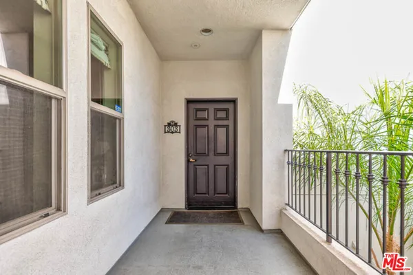 a view of a hallway with windows