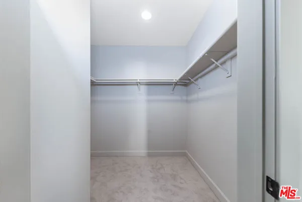 a view of an empty walk in closet
