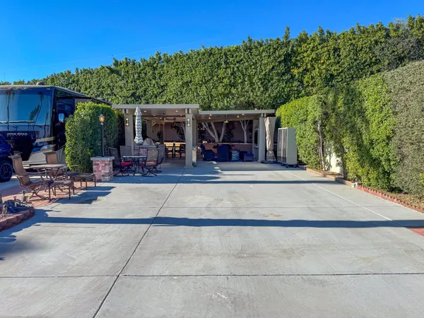 a view of a chairs and tables in patio