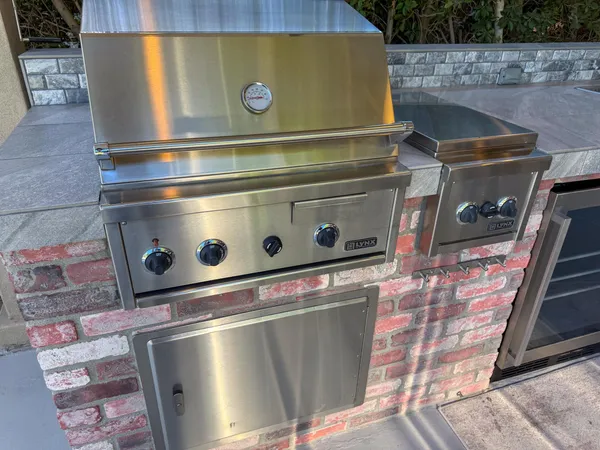 a stove top oven sitting inside of a kitchen
