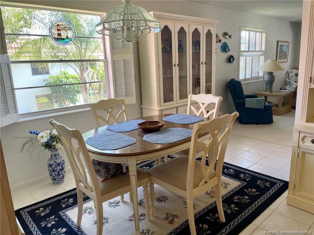 2600 Southeast Ocean Boulevard, Unit H9 Stuart, FL 34996 - Photo 11 of 21 a view of a dining room with furniture window and outside view