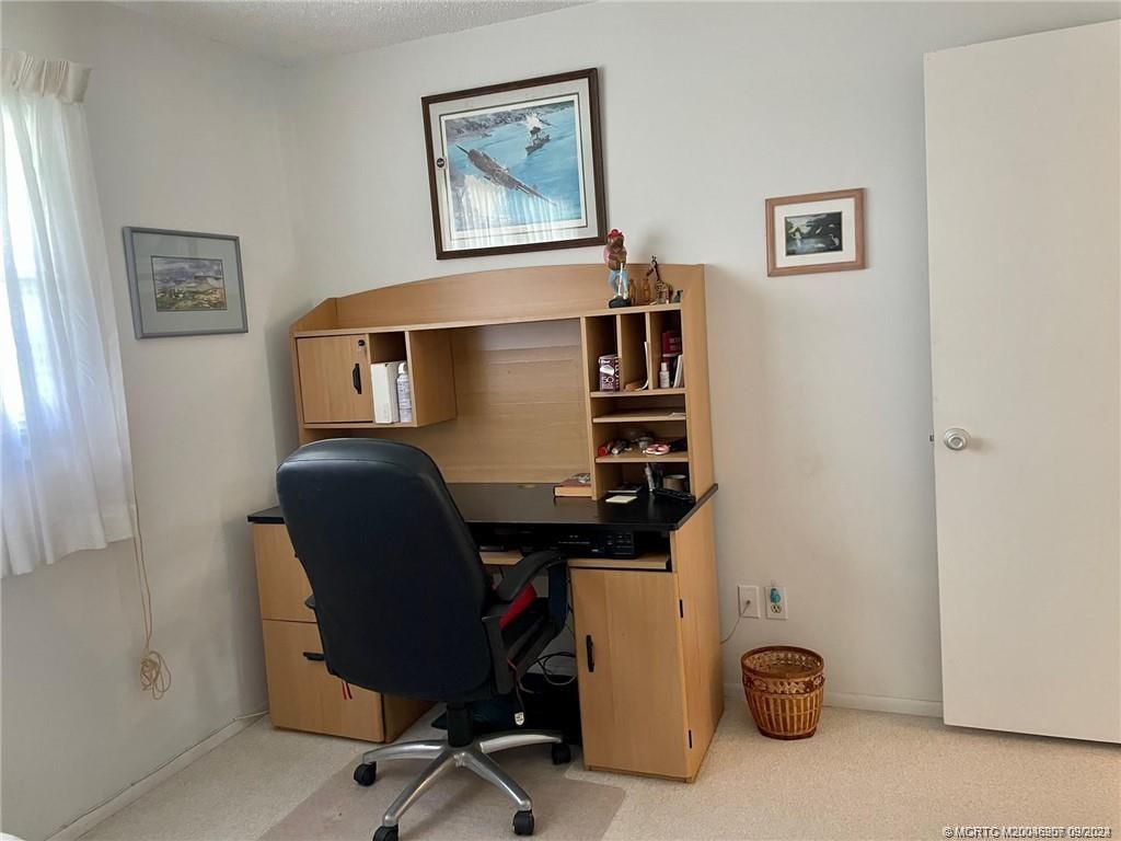 2600 Southeast Ocean Boulevard, Unit H9 Stuart, FL 34996 - Photo 16 of 21 a view of workspace with wooden wall paintings