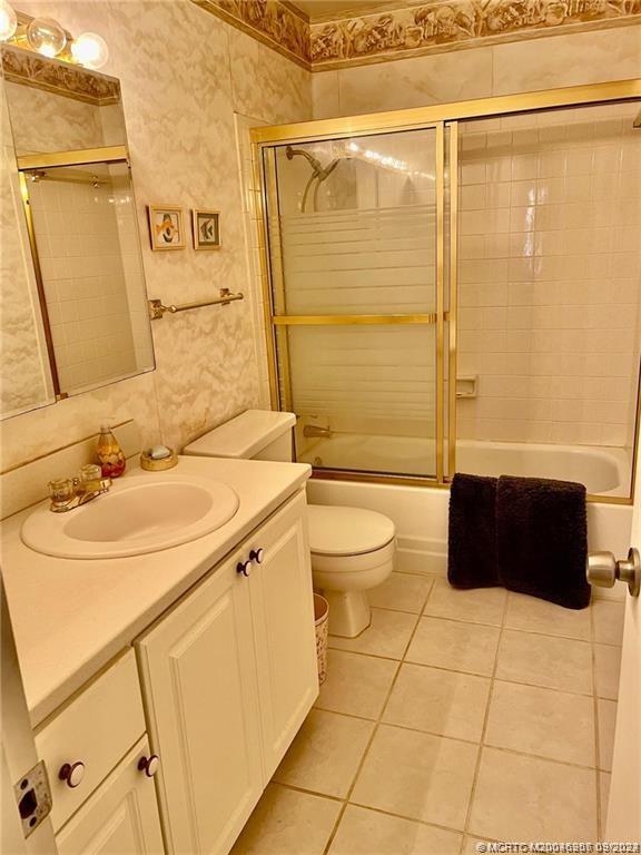 2600 Southeast Ocean Boulevard, Unit H9 Stuart, FL 34996 - Photo 17 of 21 a bathroom with a sink a toilet and shower