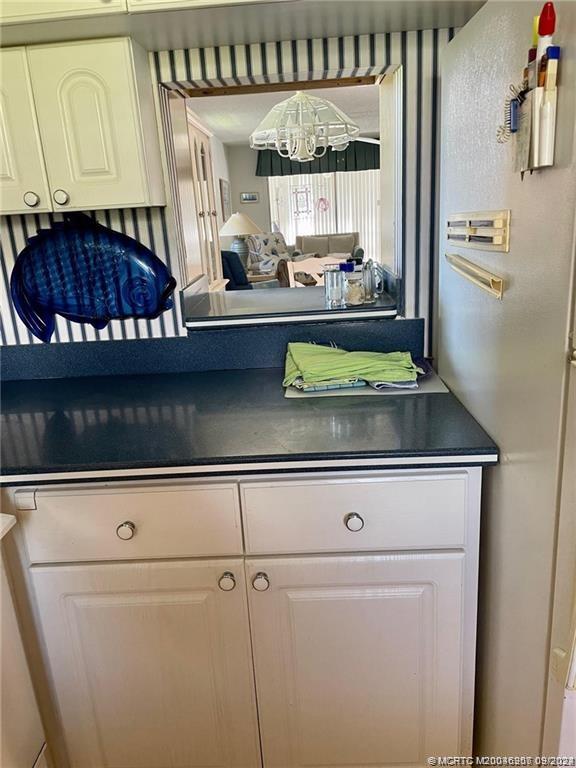2600 Southeast Ocean Boulevard, Unit H9 Stuart, FL 34996 - Photo 4 of 21 a stove top oven sitting inside of a kitchen