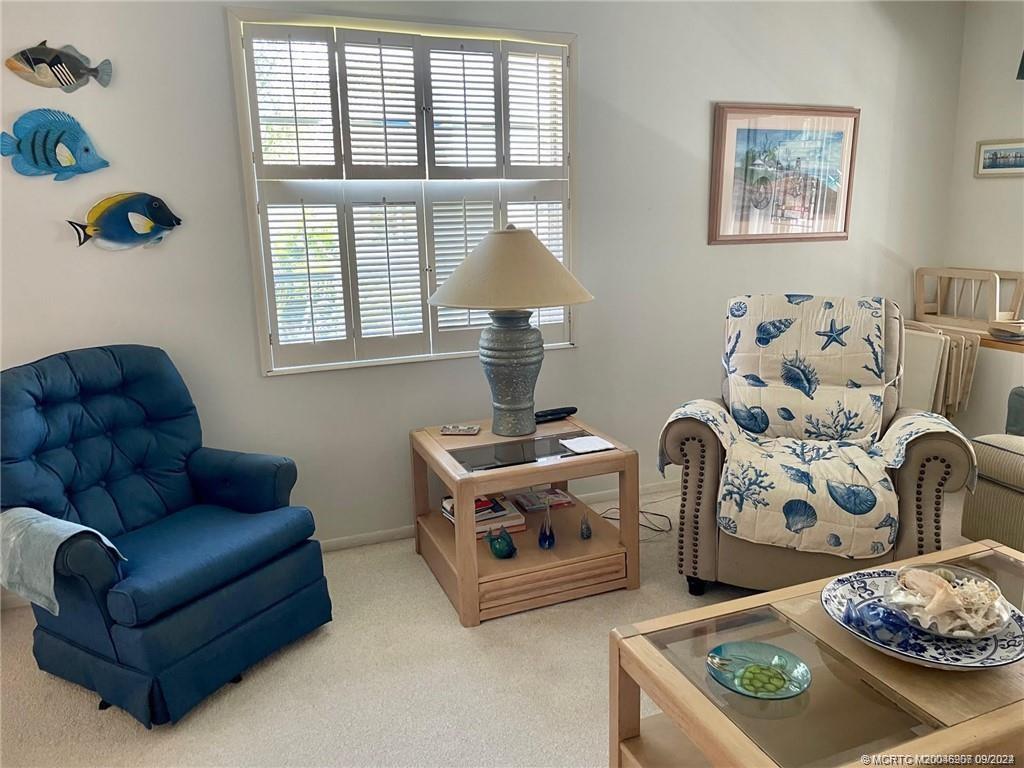 2600 Southeast Ocean Boulevard, Unit H9 Stuart, FL 34996 - Photo 5 of 21 a living room with furniture and a window