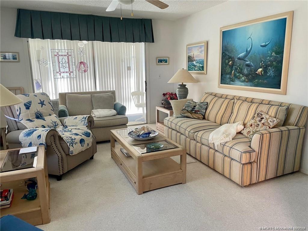 2600 Southeast Ocean Boulevard, Unit H9 Stuart, FL 34996 - Photo 6 of 21 a living room with furniture and a large window