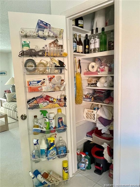 2600 Southeast Ocean Boulevard, Unit H9 Stuart, FL 34996 - Photo 7 of 21 a picture of a store room with shelves