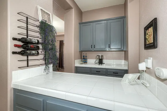 a view of a dining room with furniture wooden floor and a chandelier