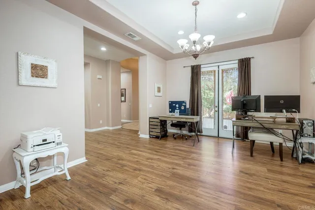a kitchen with a stove and a white cabinet