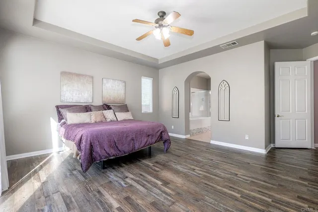 a spacious bathroom with a tub sink a mirror a vanity and shower