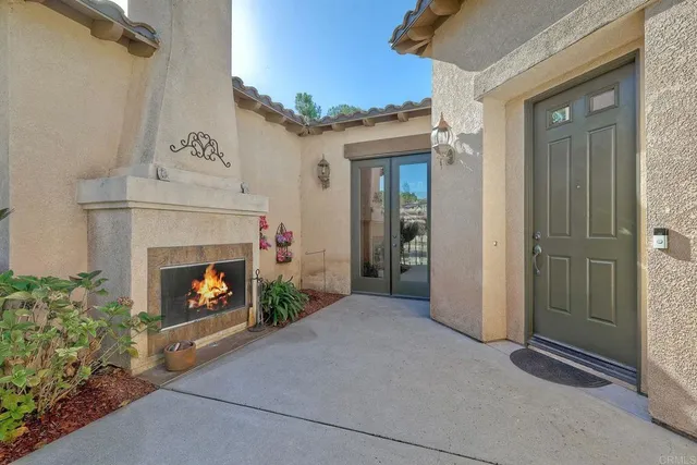 a view of an empty room with fire place and a fireplace