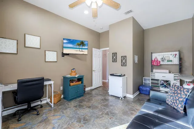 a swimming pool with outdoor seating and yard