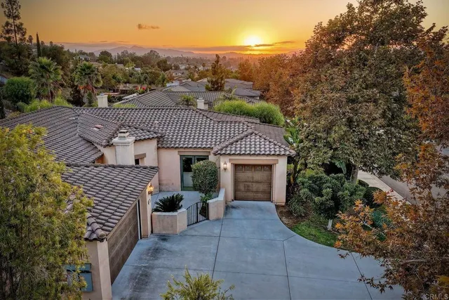 an aerial view of residential house and green space