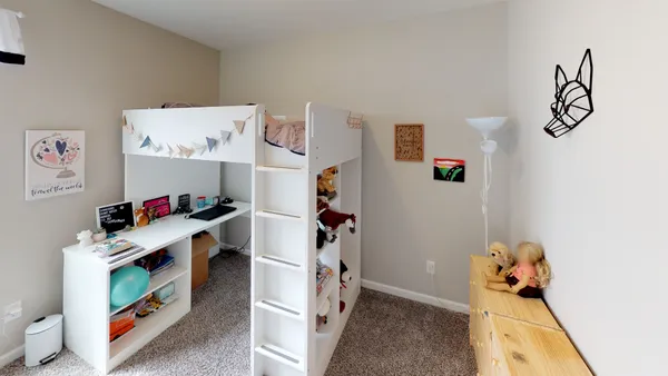a room with furniture and white walls