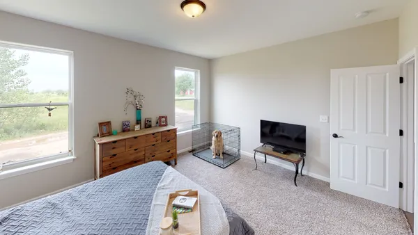 a bed room with furniture and a window