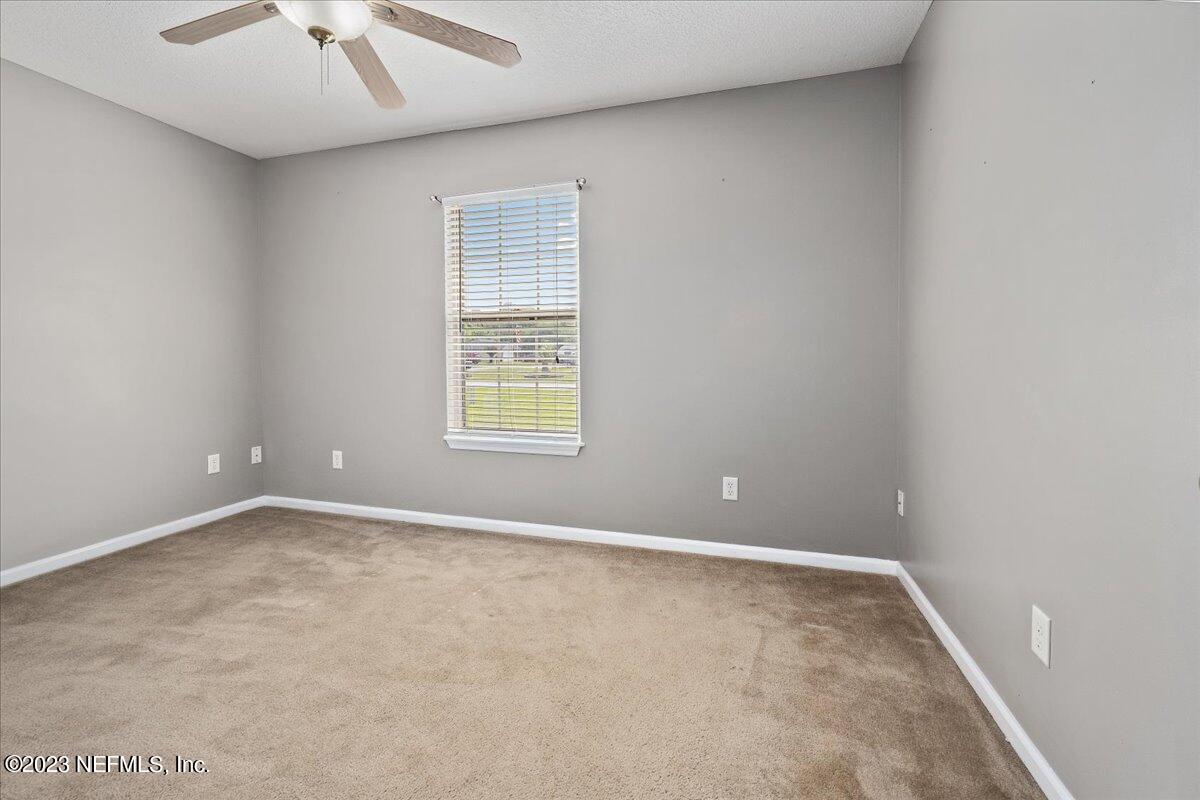 681 Fox Run Circle Macclenny, FL 32063 - Photo 11 of 18 an empty room with a window