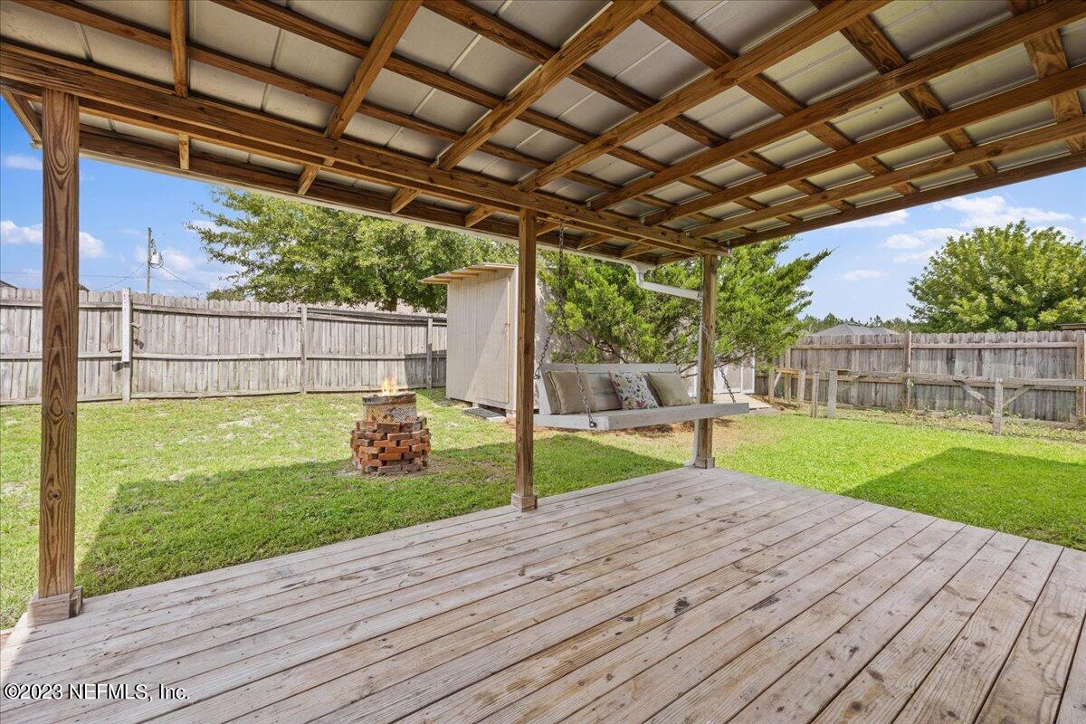 681 Fox Run Circle Macclenny, FL 32063 - Photo 14 of 18 a view of a backyard with sitting area