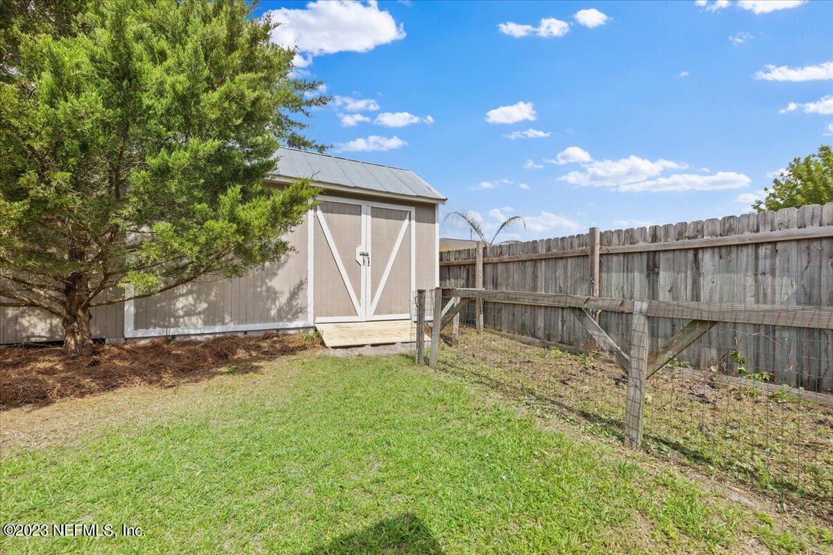 681 Fox Run Circle Macclenny, FL 32063 - Photo 15 of 18 a view of backyard with wooden fence