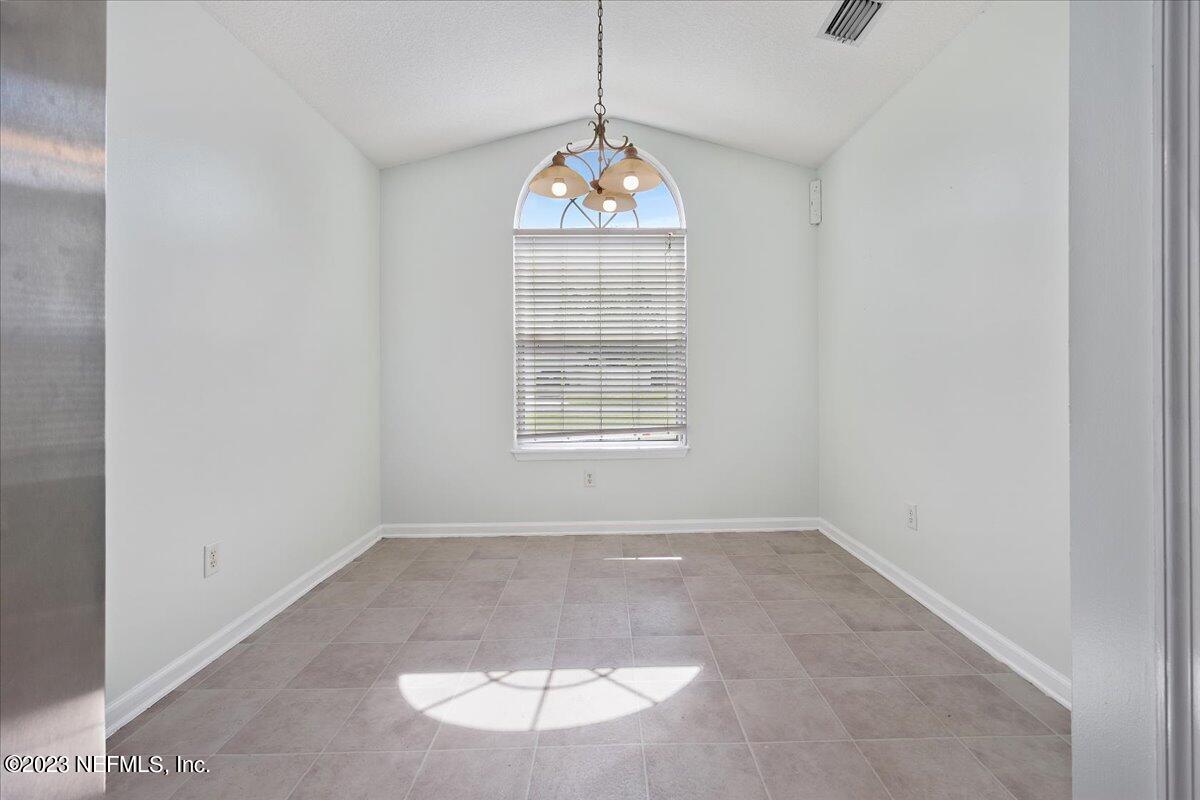 681 Fox Run Circle Macclenny, FL 32063 - Photo 6 of 18 an empty room with windows and ceiling fan