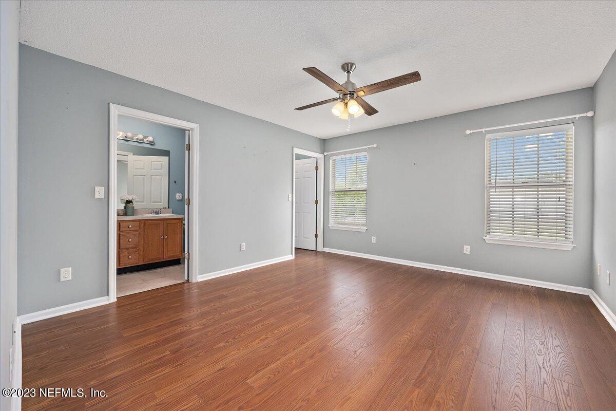 681 Fox Run Circle Macclenny, FL 32063 - Photo 7 of 18 a view of an empty room with wooden floor and a window