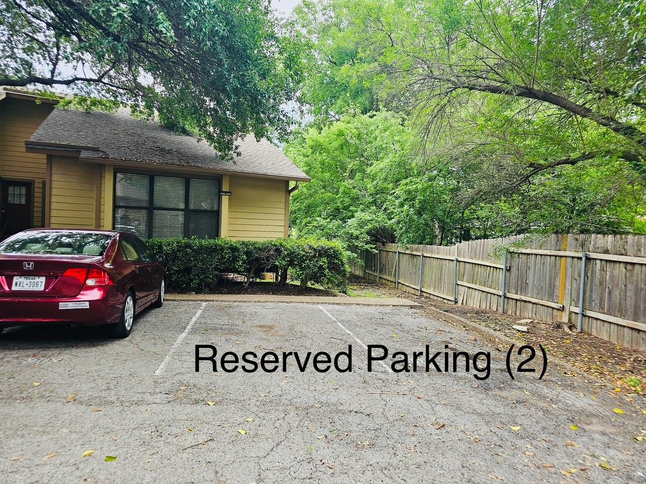 5107 Leralynn Street, Unit 304 Austin, TX 78751 - Photo 16 of 28 Uncovered parking lot featuring fence