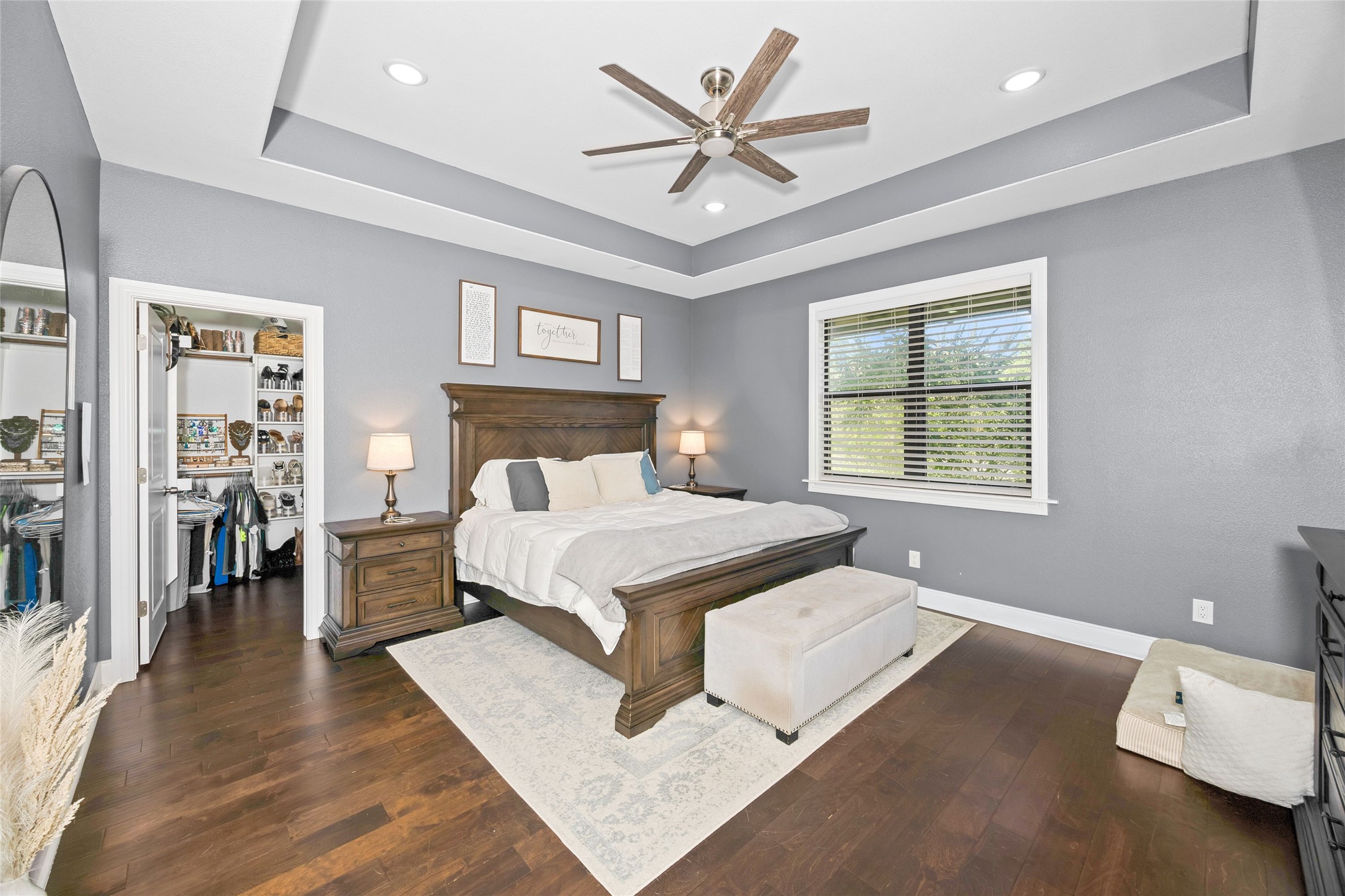 2021 Strangmeier Road Brenham, TX 77833 - Photo 11 of 16 Your luxurious primary bedroom combines comfort and elegance with the rich flooring and impressive tray ceiling.