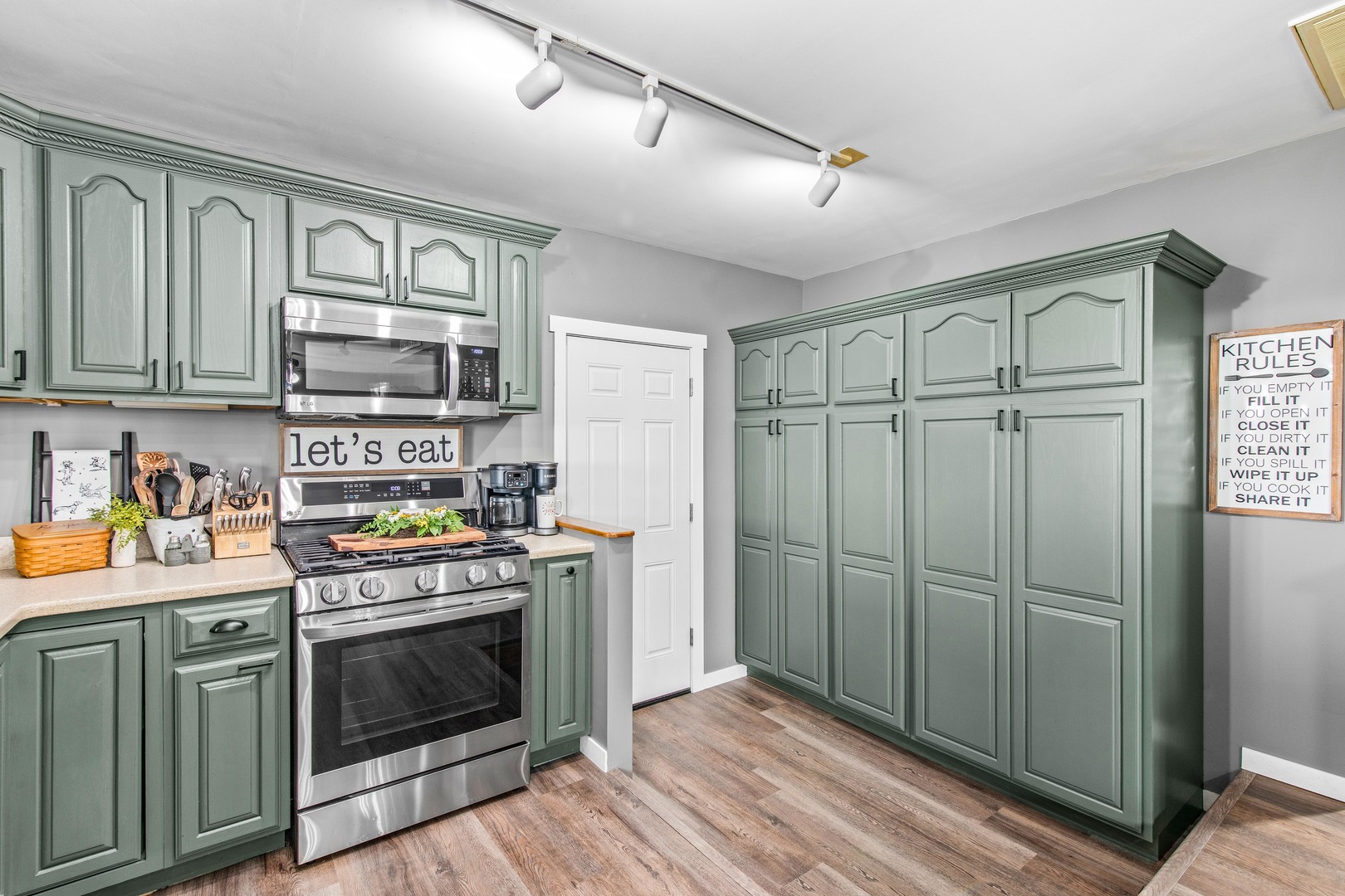 4698 East 17th Road Leland, IL 60531 - Photo 12 of 57 a kitchen with a stove and a refrigerator