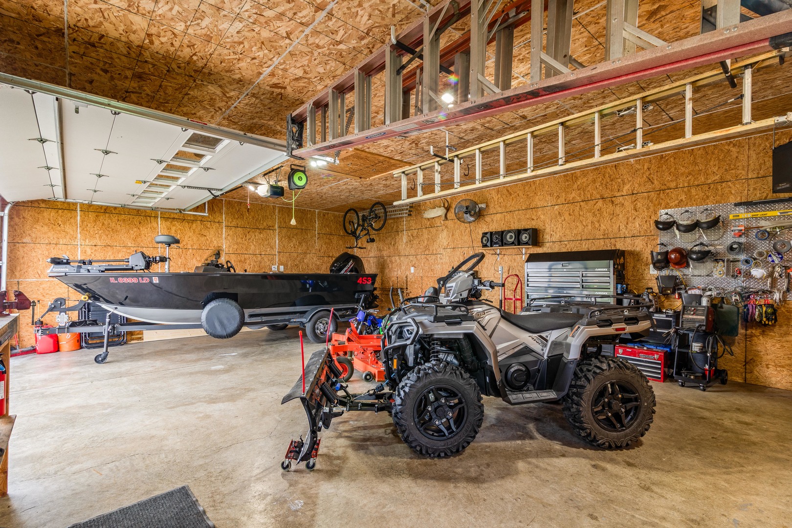 4698 East 17th Road Leland, IL 60531 - Photo 31 of 57 a view of a garage with a bike and a car