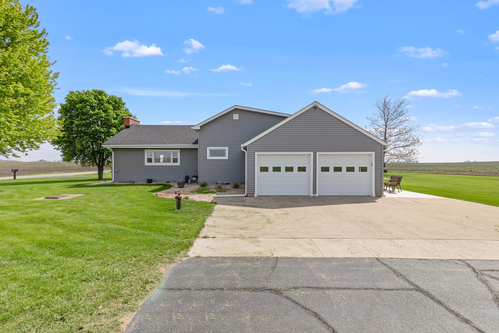4698 East 17th Road Leland, IL 60531 - Photo 37 of 57 a front view of a house with a yard and garage