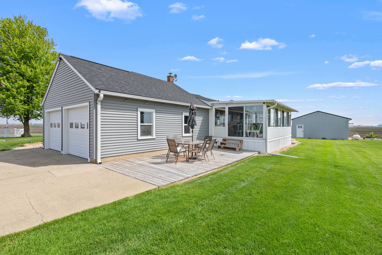 4698 East 17th Road Leland, IL 60531 - Photo 38 of 57 a view of backyard of house with outdoor seating and green space