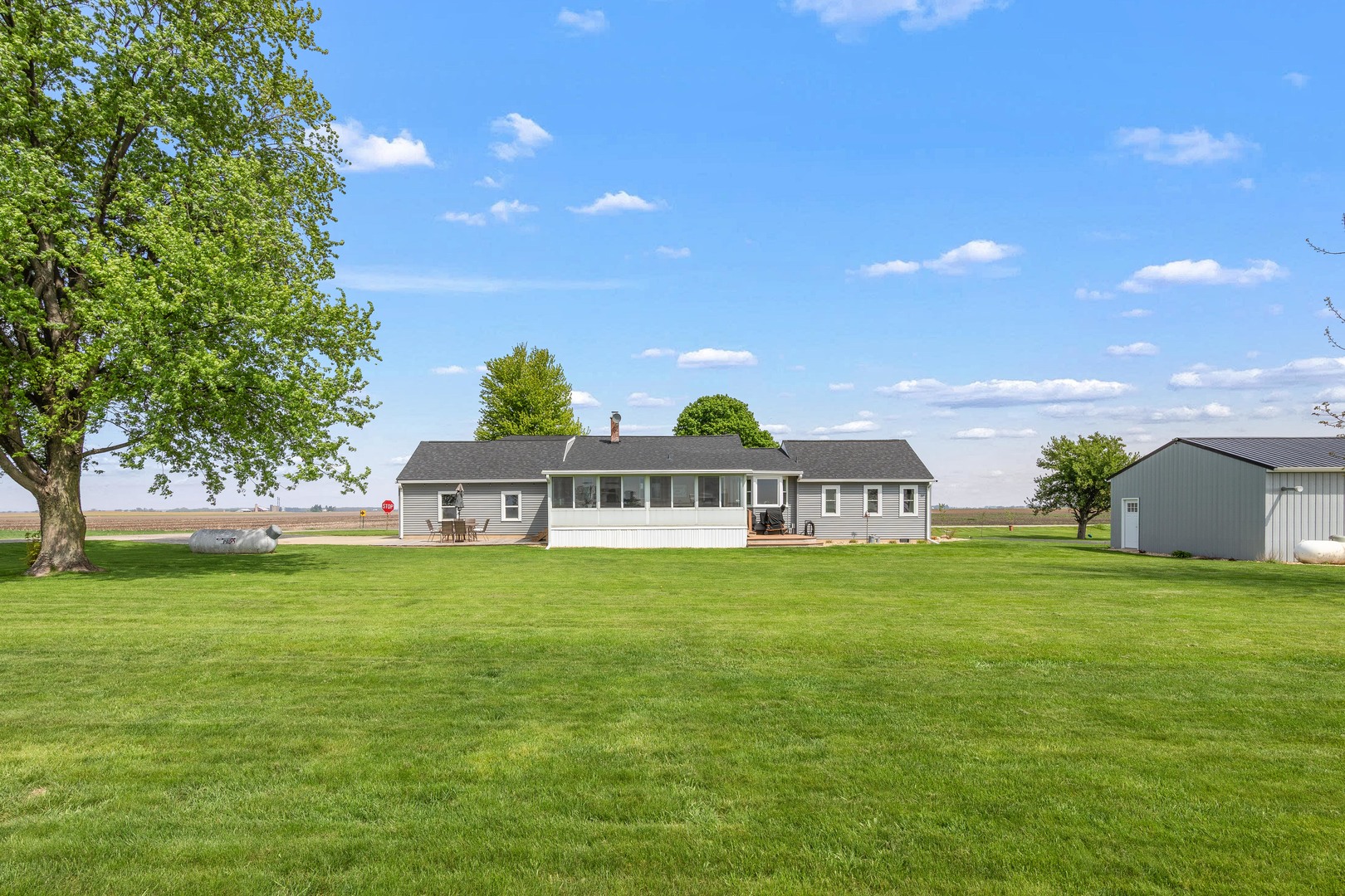 4698 East 17th Road Leland, IL 60531 - Photo 40 of 57 a front view of a house with a garden
