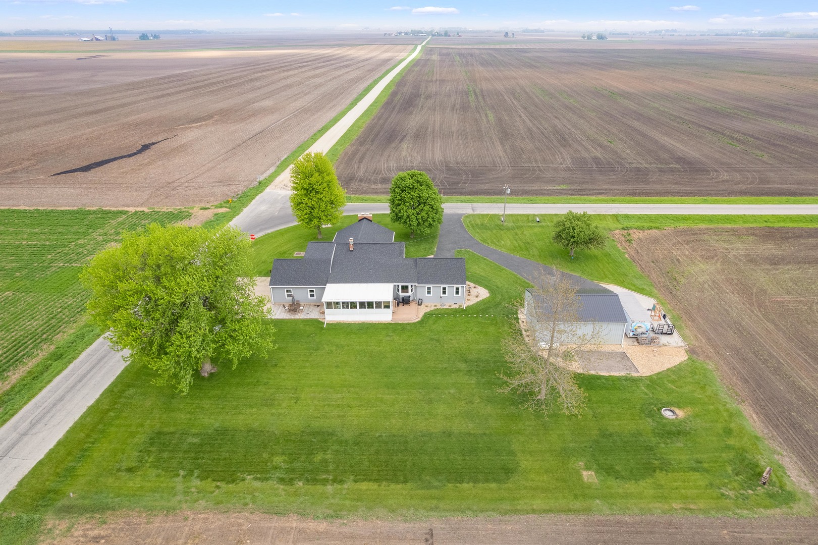 4698 East 17th Road Leland, IL 60531 - Photo 50 of 57 a view of a swimming pool with a yard