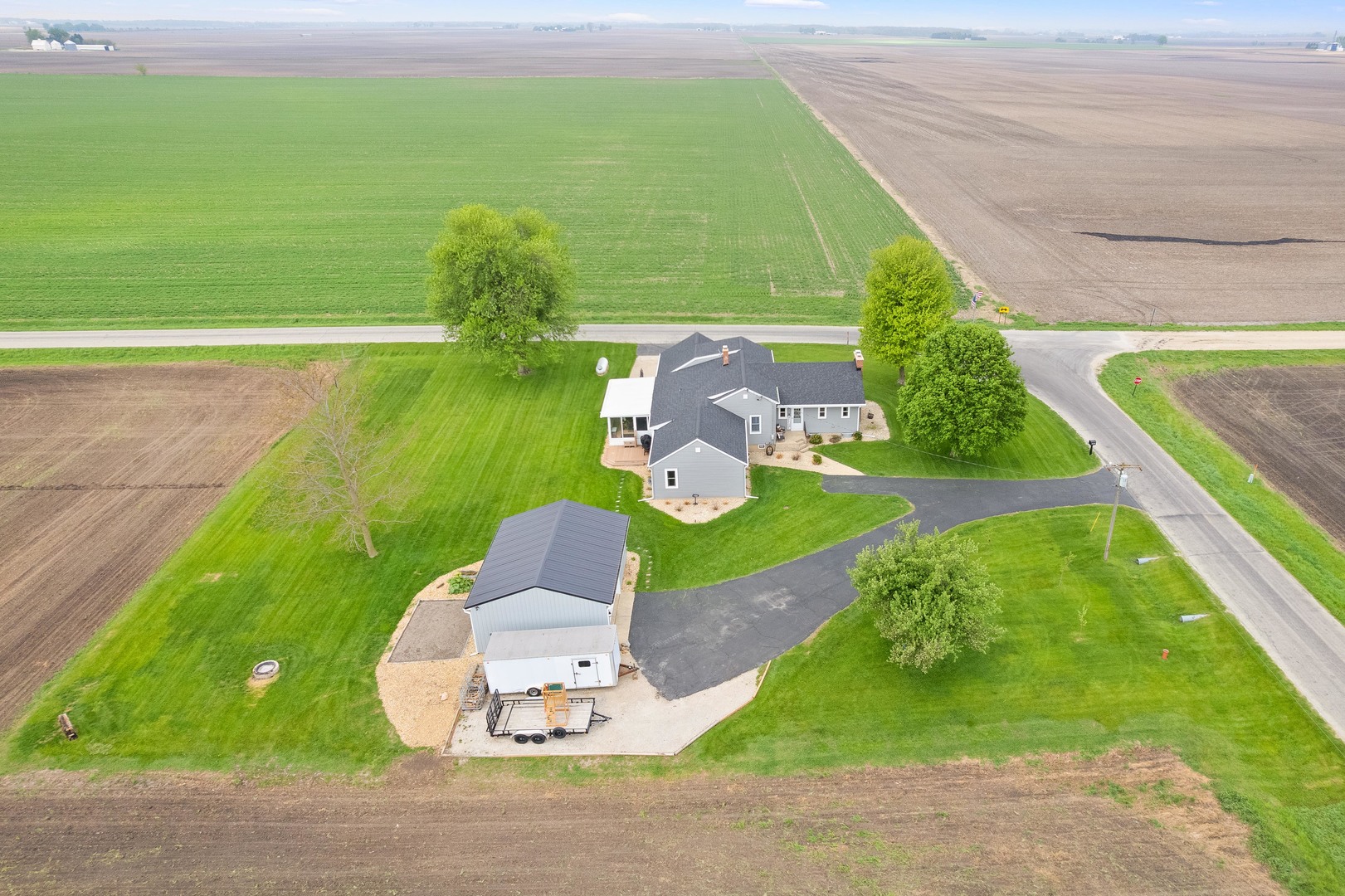 4698 East 17th Road Leland, IL 60531 - Photo 52 of 57 a view of a garden with a houses