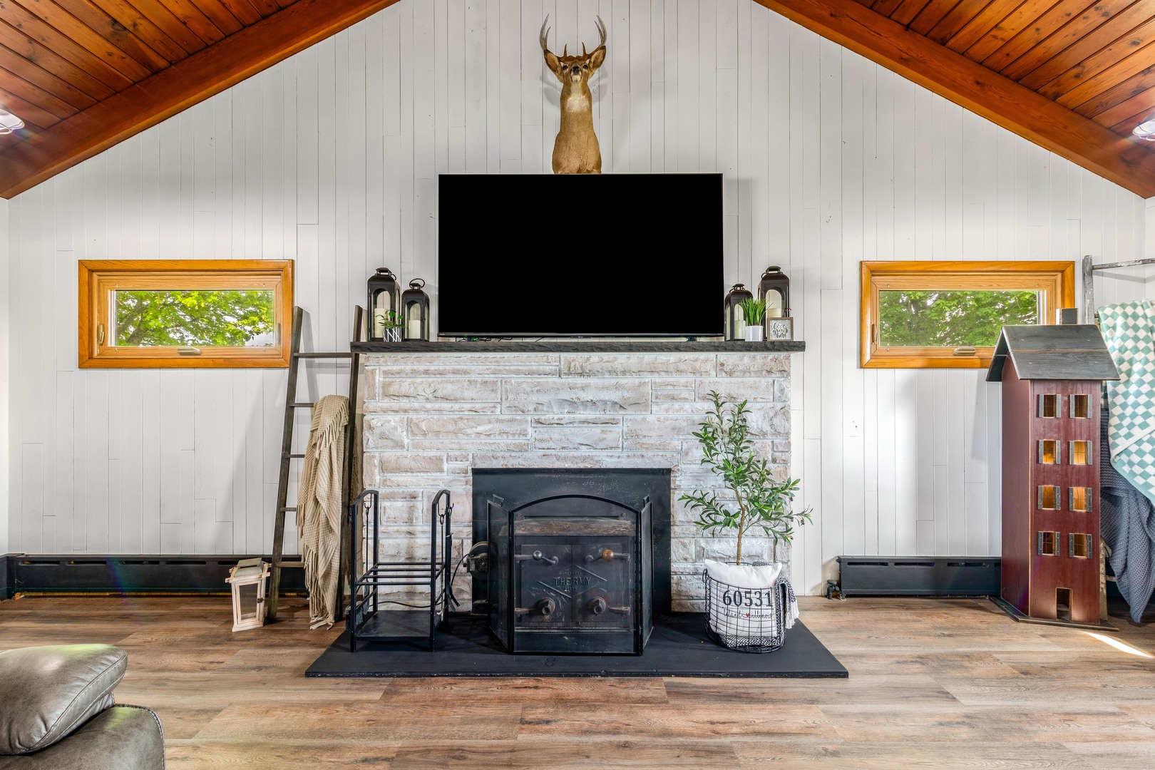 4698 East 17th Road Leland, IL 60531 - Photo 7 of 57 a living room with fireplace and a flat screen tv