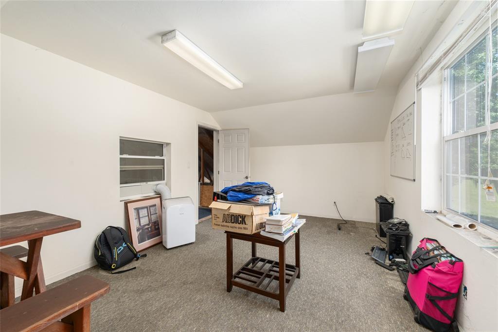 4735 Southeast 112th Street Road Belleview, FL 34420 - Photo 62 of 73 a room with furniture and a window