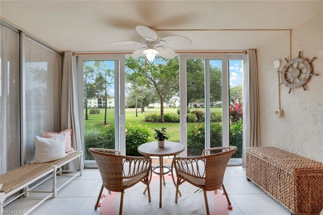 a dining room with furniture mountain view and a floor to ceiling window