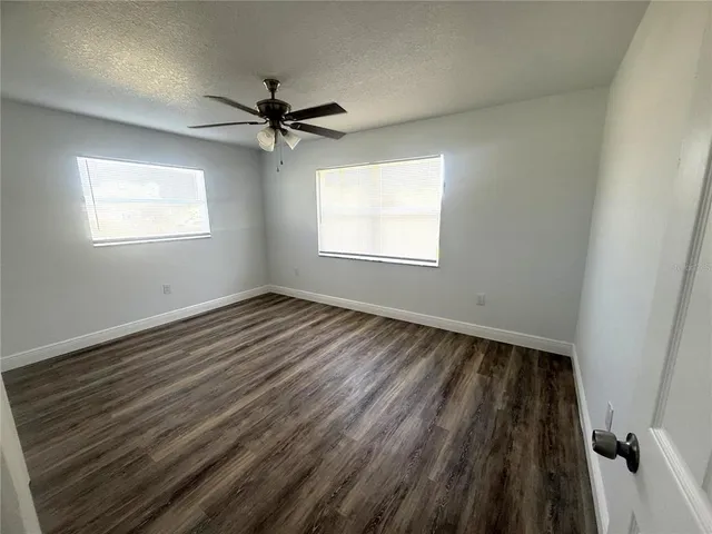 a bathroom with a sink toilet double vanity and tub