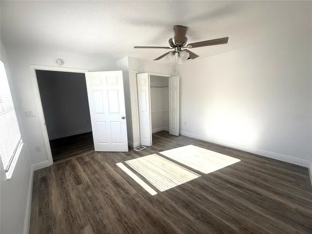a view of a bathroom with a shower and closet