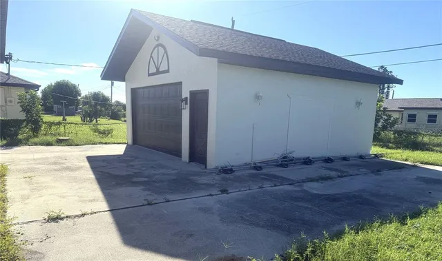 a view of garage with a car parked