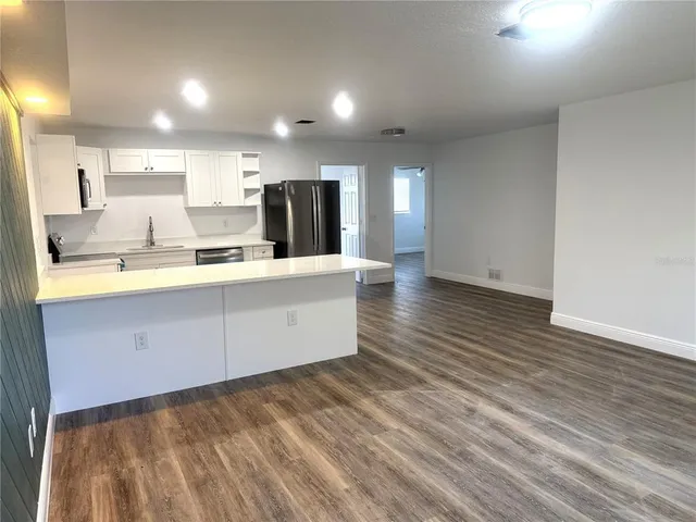 a view of kitchen with wooden floor