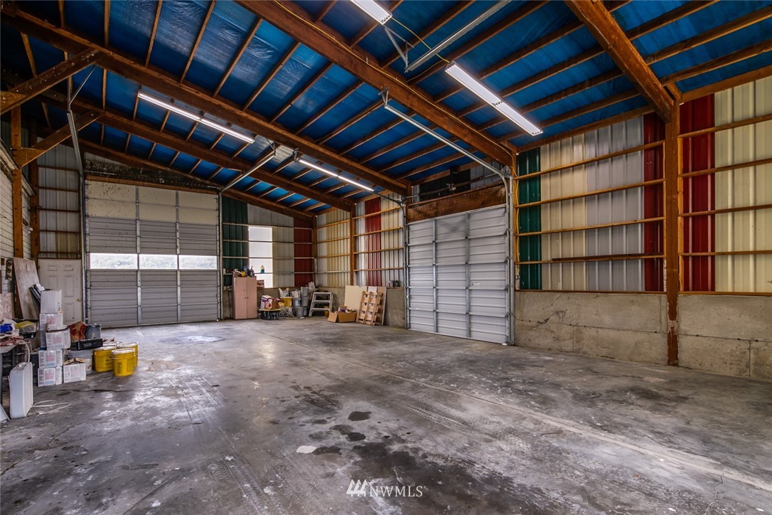 7332 Nooksack Road Everson, WA 98247 - Photo 17 of 33 a view of the empty room with wooden shelves