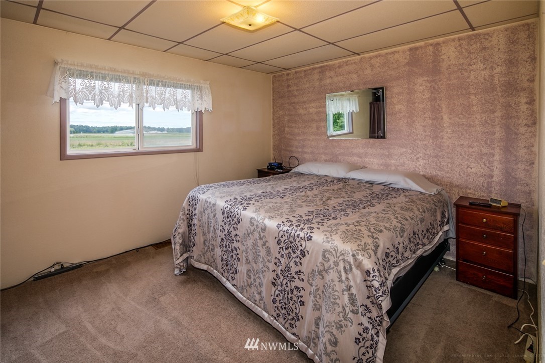 7332 Nooksack Road Everson, WA 98247 - Photo 5 of 33 a bedroom with a bed and a window