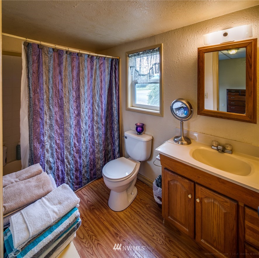 7332 Nooksack Road Everson, WA 98247 - Photo 7 of 33 a bathroom with a sink and a mirror